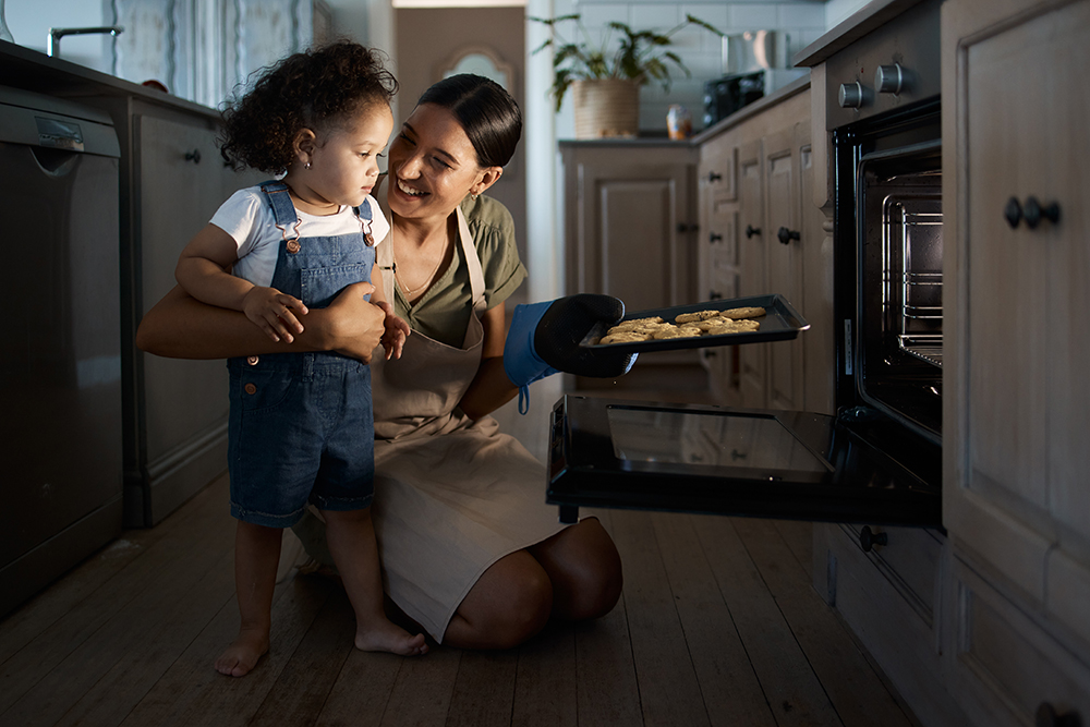 woman baking with young daughter